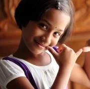 a girl showing flute symbol with her hand